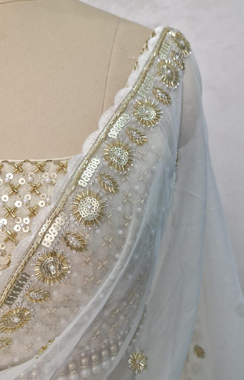 Off white Georgette Tiered Lehenga Choli DVMTD_0264