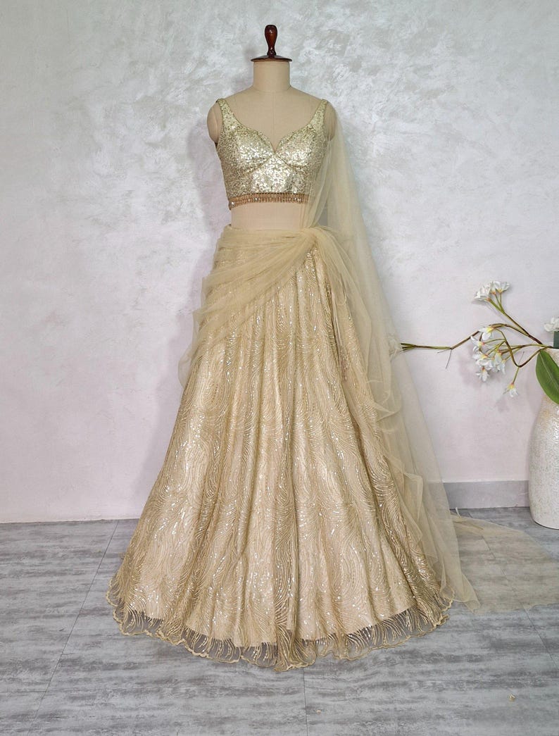 Champagne Gold Embroidered Net Lehenga Choli DVMTD_0275