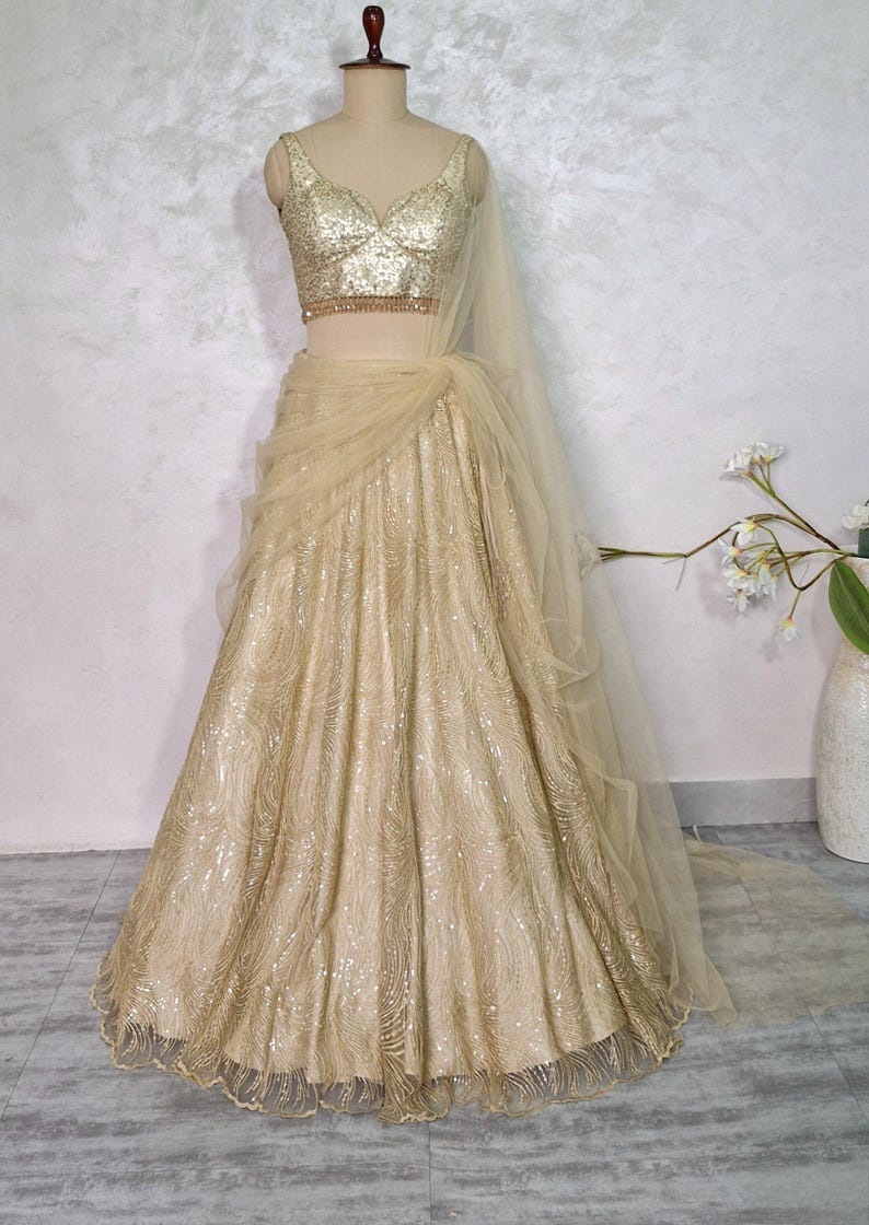 Champagne Gold Embroidered Net Lehenga Choli DVMTD_0275