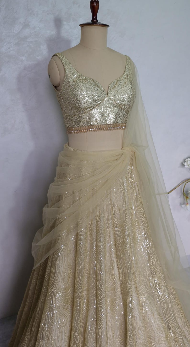 Champagne Gold Embroidered Net Lehenga Choli DVMTD_0275