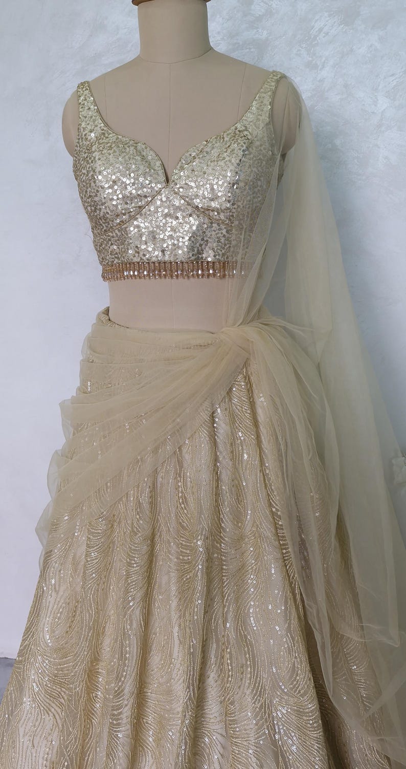 Champagne Gold Embroidered Net Lehenga Choli DVMTD_0275