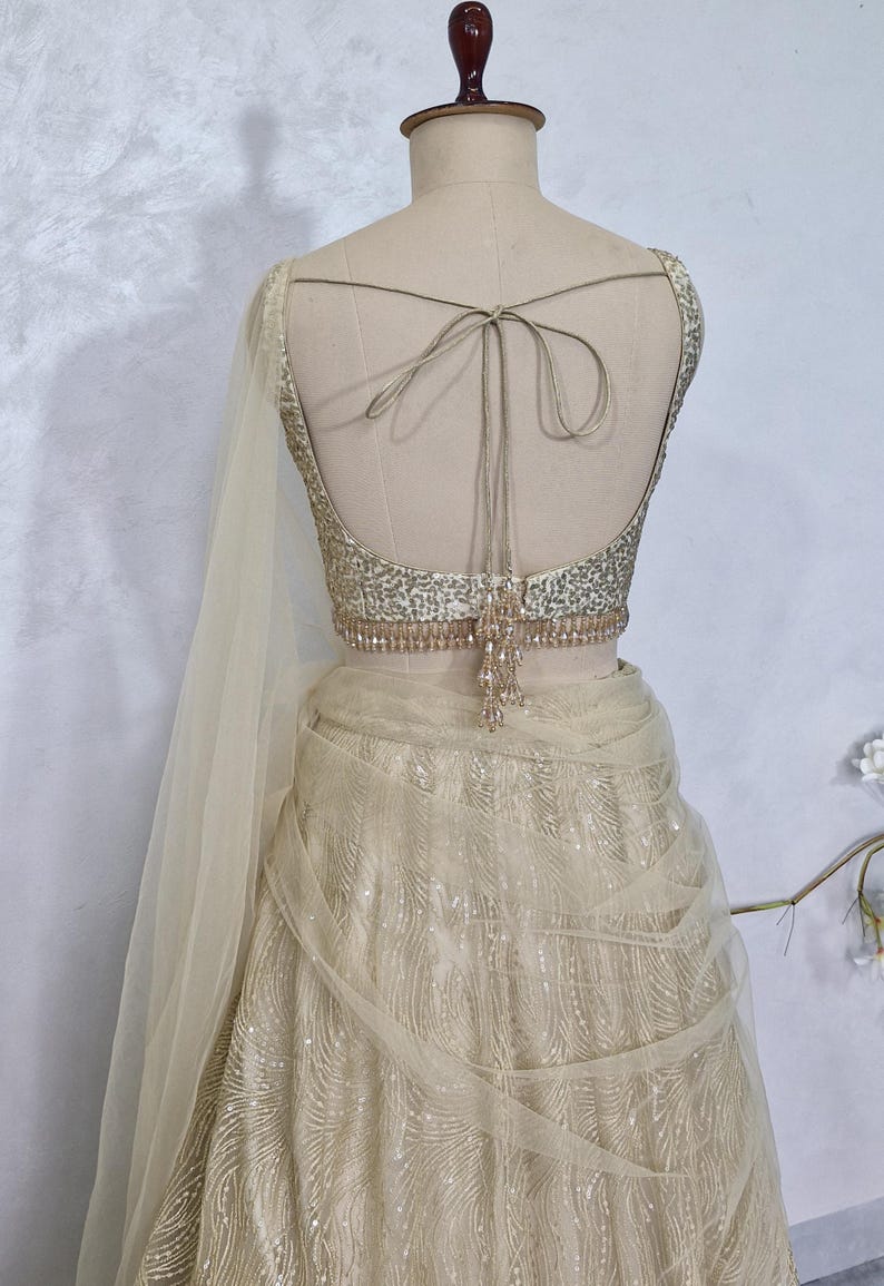 Champagne Gold Embroidered Net Lehenga Choli DVMTD_0275